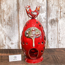 Tall hand-made ceramic “Egg” with bird adornment.