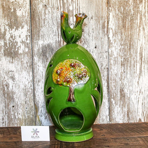 Tall hand-made ceramic “Egg” with bird adornment.